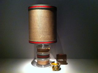 straw and leather lamp with the familiar Gucci stripes.