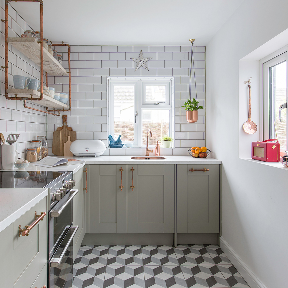 kitchen with white tiles and kitchen cabinet