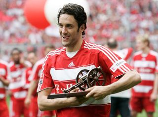 Bayern Munich's Luca Toni poses with the Bundesliga top scorer trophy, 2008