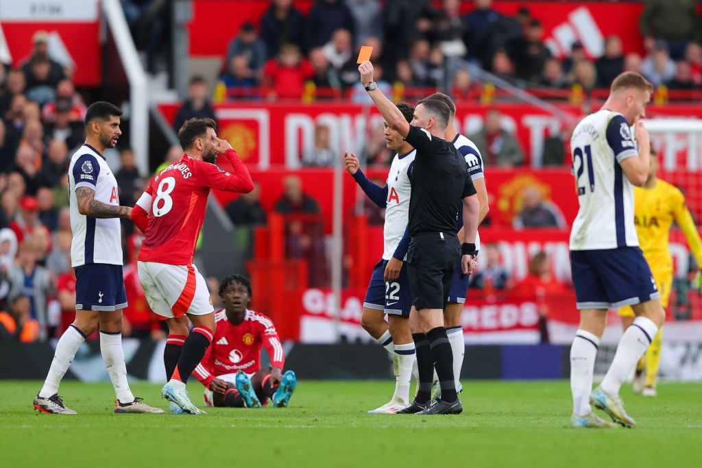 MANCHESTER, ENGLAND - SEPTEMBER 29: Bruno Fernandes of Manchester United is shown a red card by referee Chris Kavanagh during the Premier League match between Manchester United FC and Tottenham Hotspur FC at Old Trafford on September 29, 2024 in Manchester, England. (Photo by James Gill - Danehouse/Getty Images)