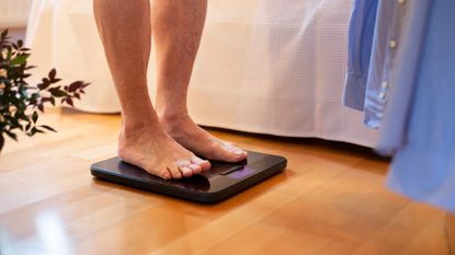 Person stepping on the scales