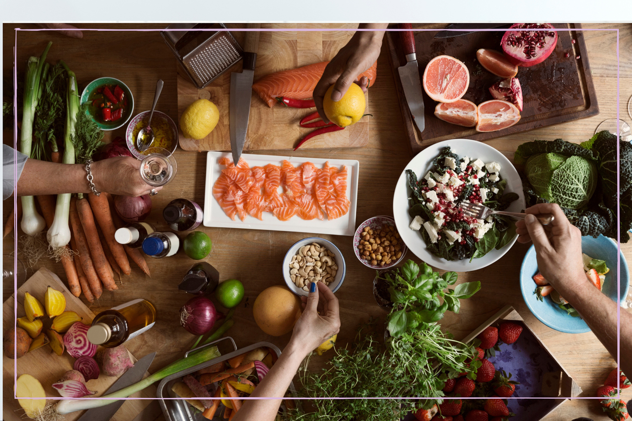 A plate of food eaten in on the Nordic diet - salmon, nuts and fresh vegetables