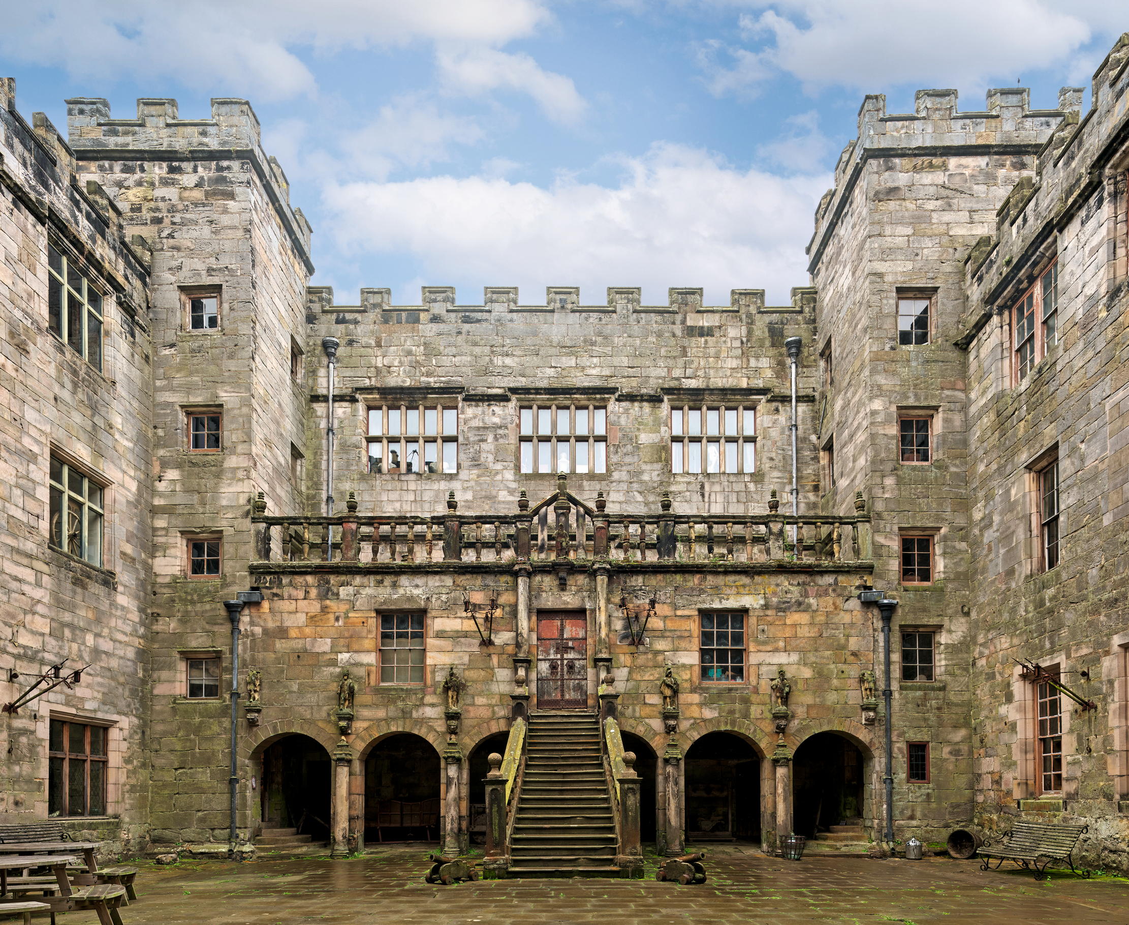 Fig 1: The internal courtyard, loggia and stairway to the hall door of the castle. Chillingham Castle, Northumberland.