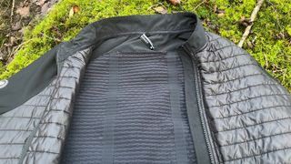 Closeup of cycling jacket lying on mossy ground