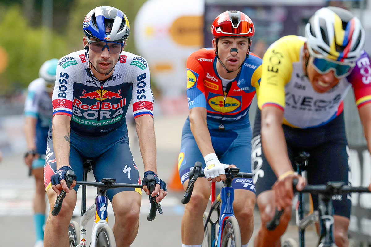 Roglič racing across the Giro d'Italia stage 7 finish line with Giulio Ciccone and Egan Bernal