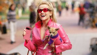 Elle Woods holding a Pixel 9 in Peony wearing all pink to match the pink phone.