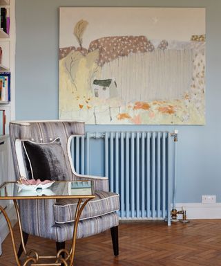 A living room with a light blue radiator