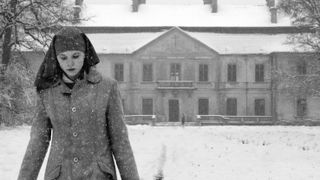 Agata Trzebuchowska walking in the snow in Ida