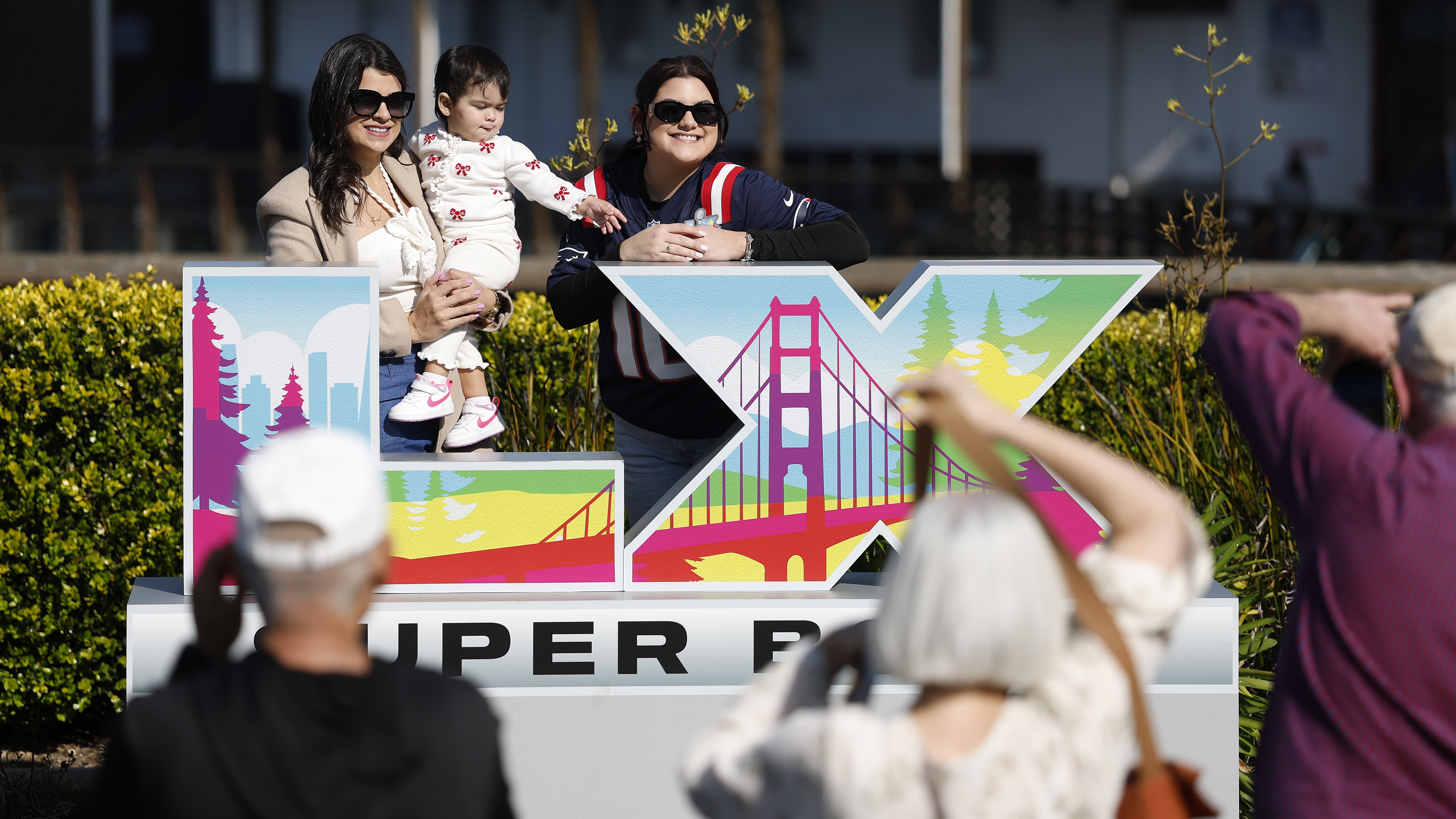 SAN FRANCISCO, CALIFORNIA - FEBRUARY 06: Visitors take a picture in front of the Super Bowl LX logo at Pier 39 on February 06, 2026 in San Francisco, California. More than 1.3 million visitors are expected to descend on San Francisco and San Jose during Super Bowl week ahead of Sunday&amp;rsquo;s matchup between the New England Patriots and the Seattle Seahawks at Levi&amp;rsquo;s Stadium in Santa Clara. (Photo by Justin Sullivan/Getty Images)