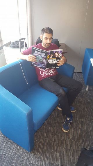 Jai spends a moment of downtime enjoying the latest edition of Metal Hammer. Thank fuck they are back, thank fuck they were not gone long!