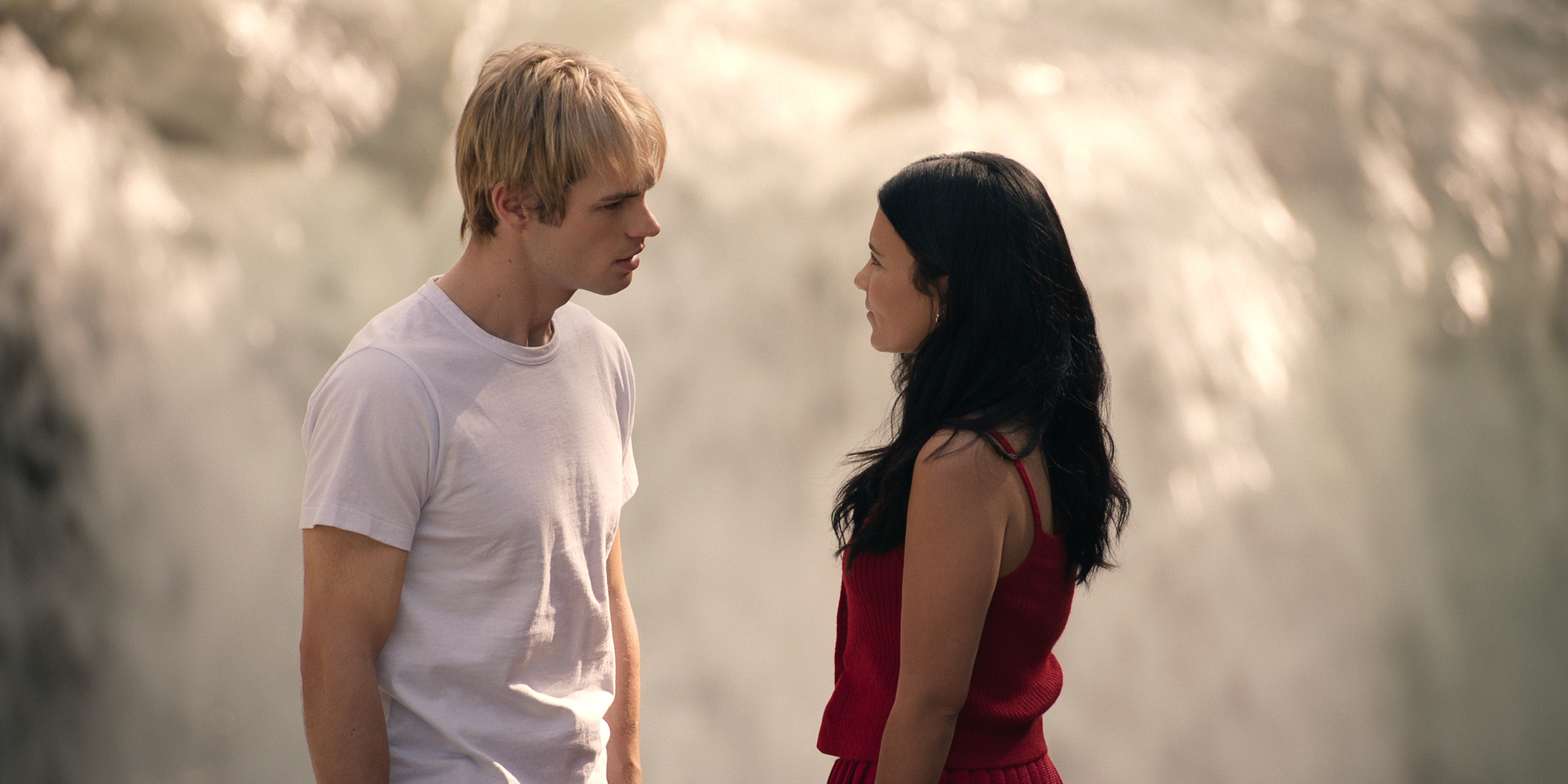 Actors Noah LaLonde and Nikki Rodriguez stand face-to-face in 'My Life with the Walter Boys.'