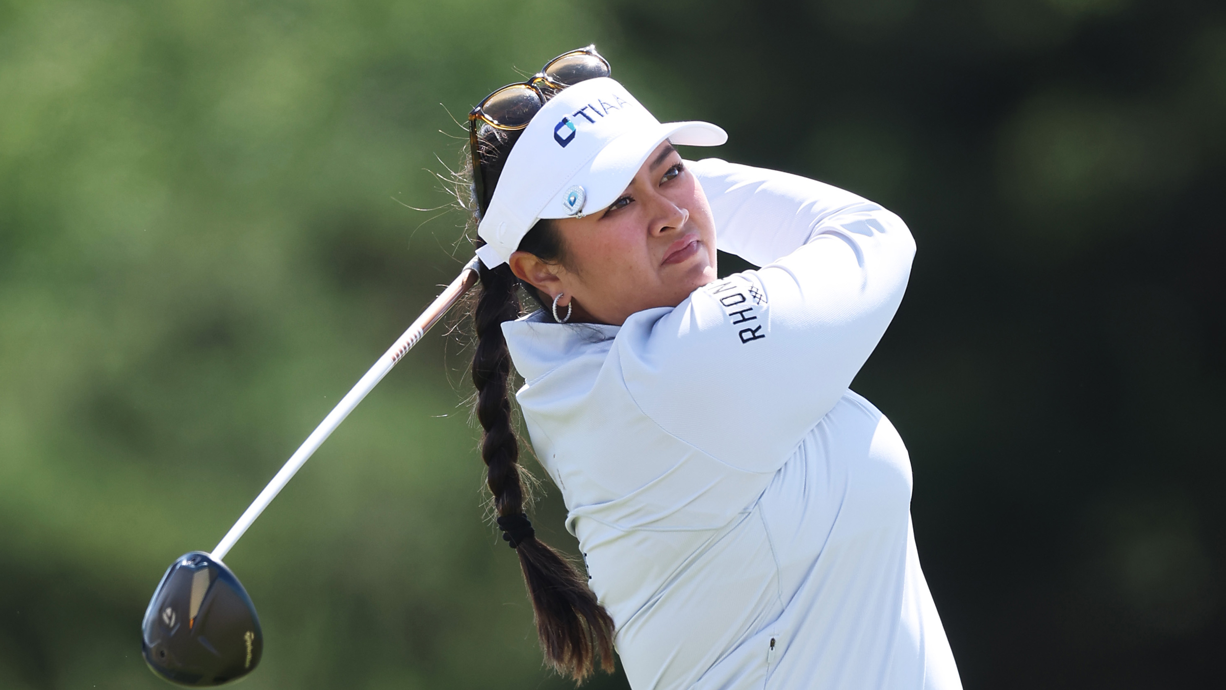 Lilia Vu holds her finish on a drive