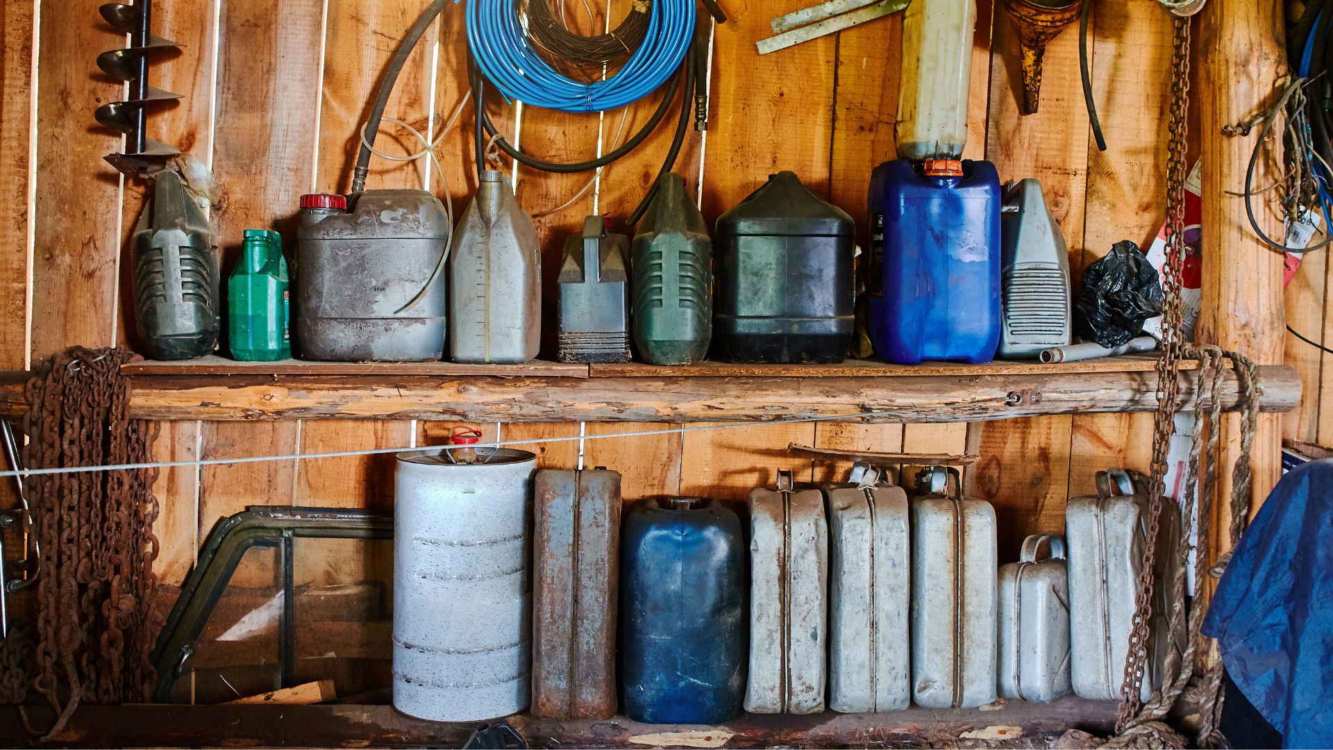 picture of random bottles and cannisters lined up in garden shed