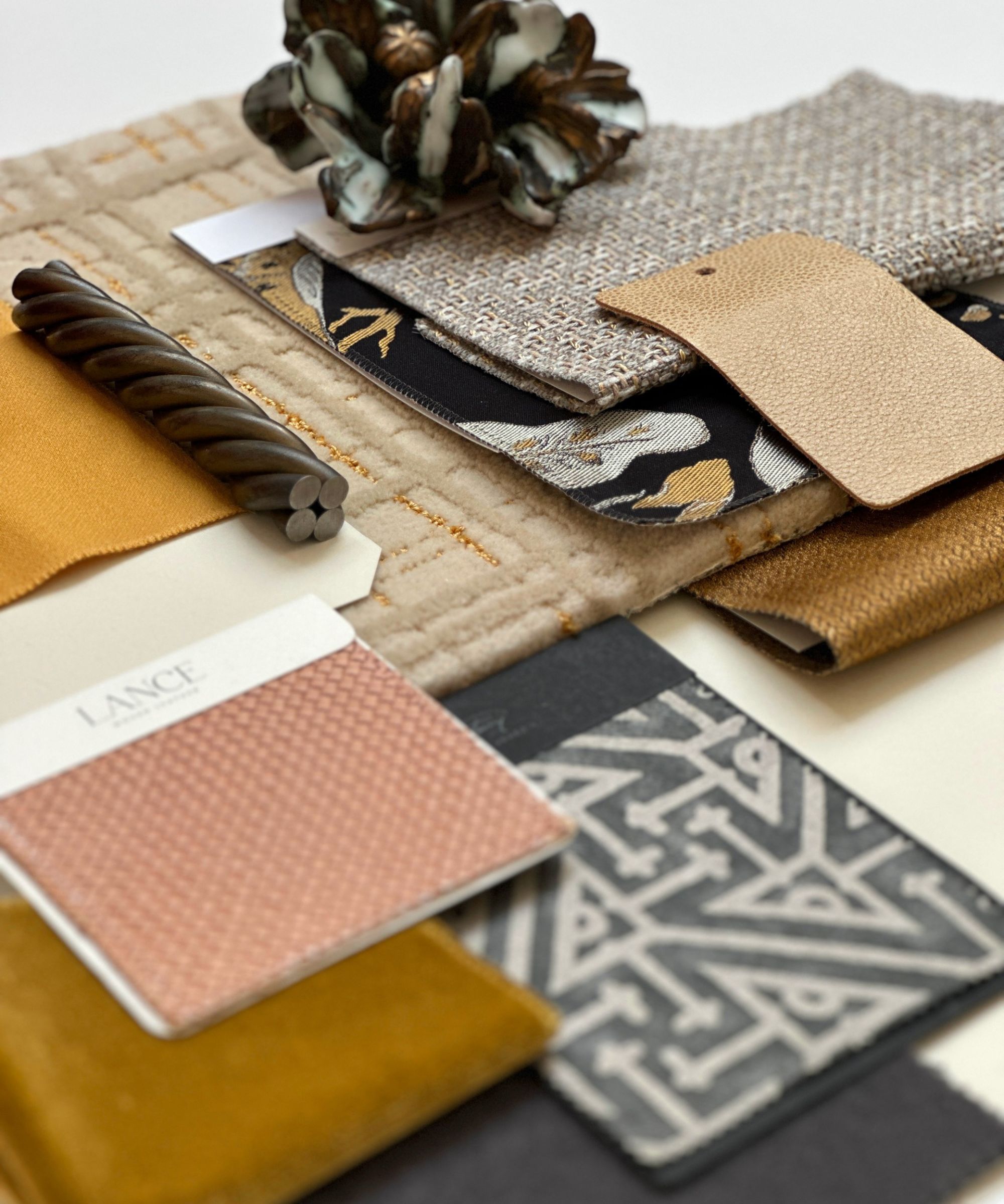 Close up of sample flat lay, showing favric samples, tile and different materials