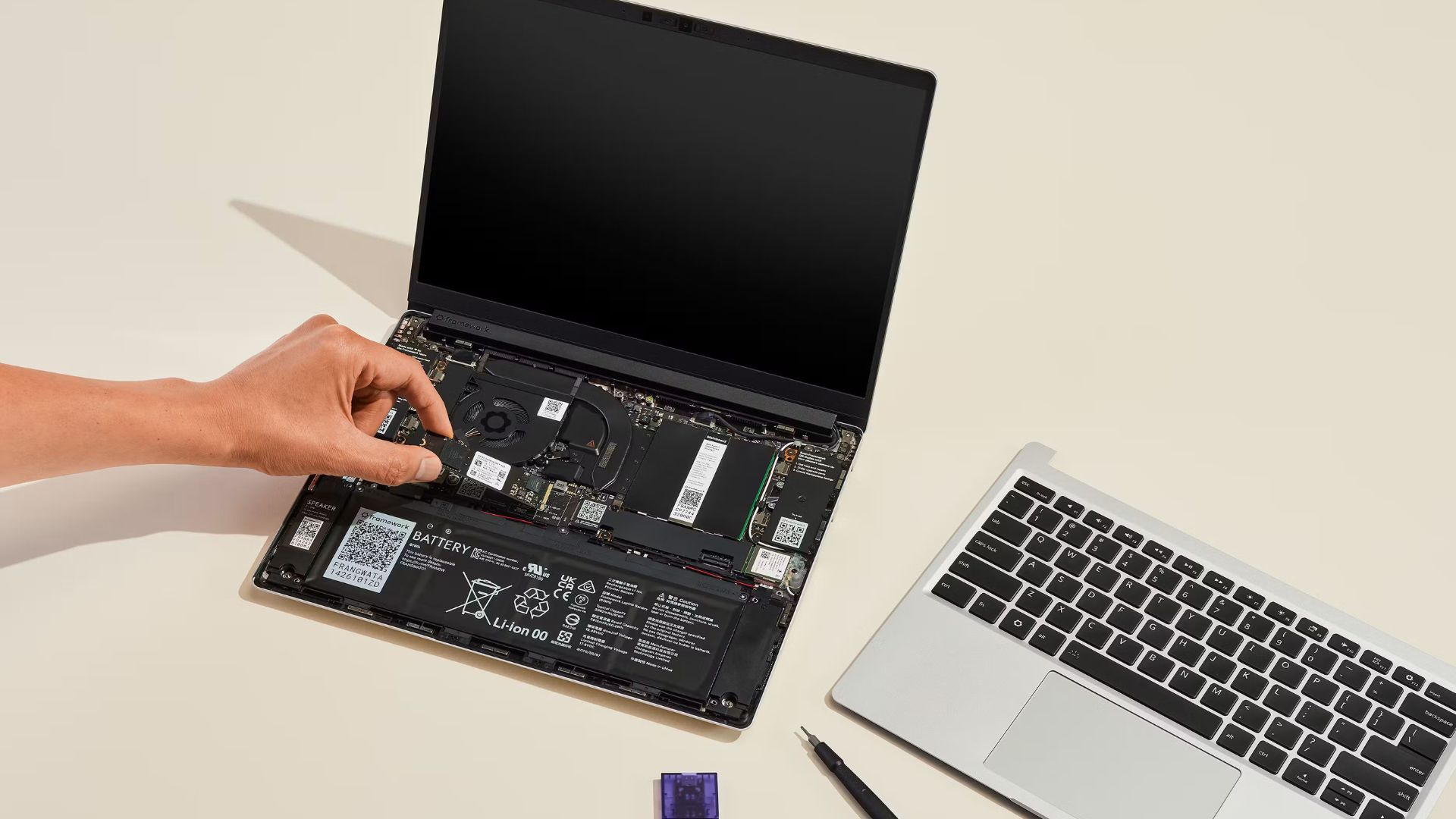 An image from Framework showing a laptop being assembled