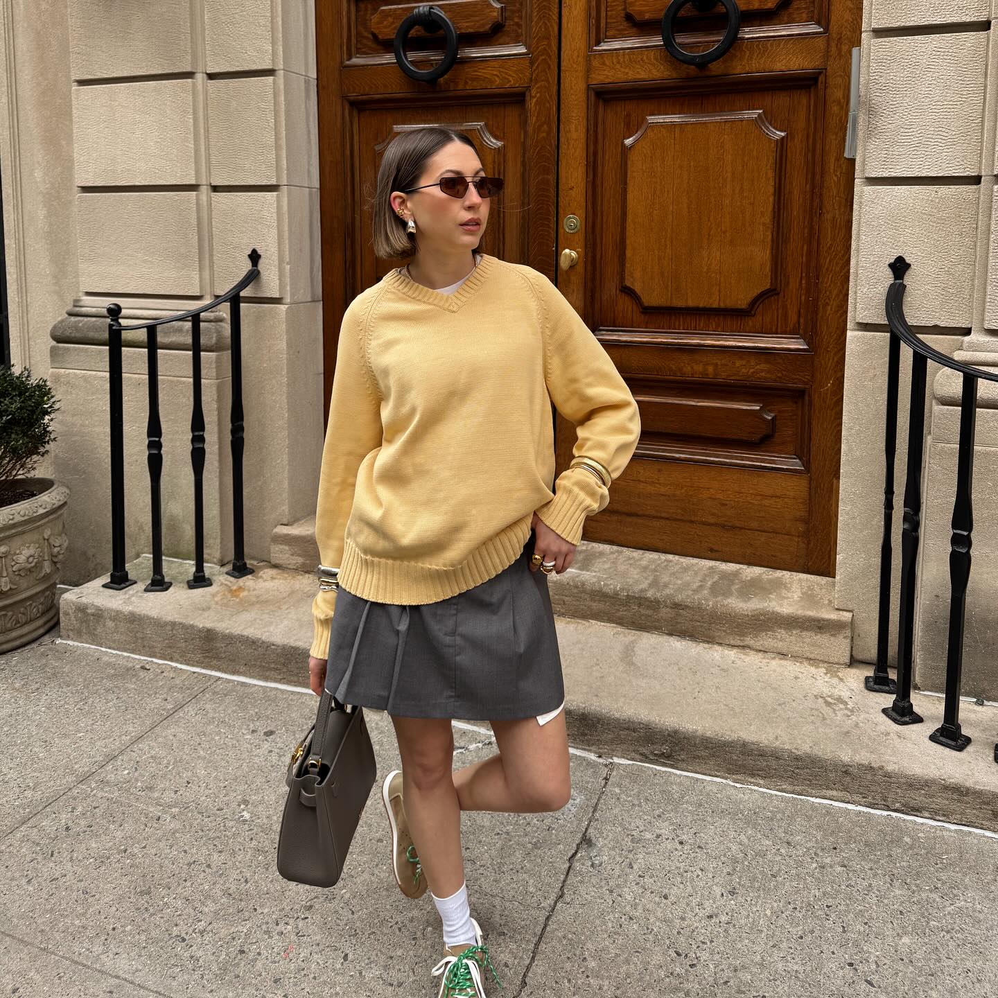 woman with short hair walking on the street