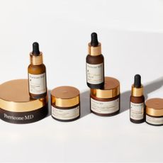 Perricone MD anti-wrinkle products in gold and brown bottles on white background.