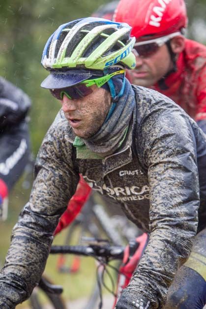 Adam Yates gets covered in mud during the Tour of Alberta