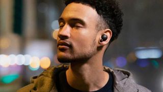 A man uses one of the best AirPods alternatives, the Sony WH-1000XM4