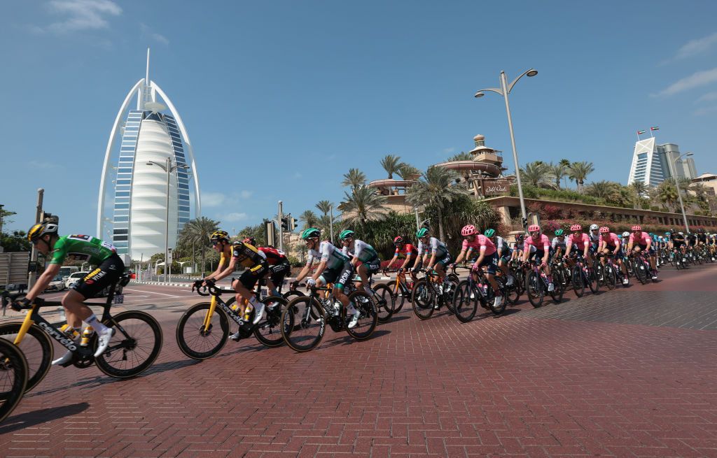 The pack rides during the sixth stage of the UAE Cycling Tour From Dubai Deira Islands to Dubai Palm Jumeriah on February 26 2021 Photo by Giuseppe CACACE AFP Photo by GIUSEPPE CACACEAFP via Getty Images
