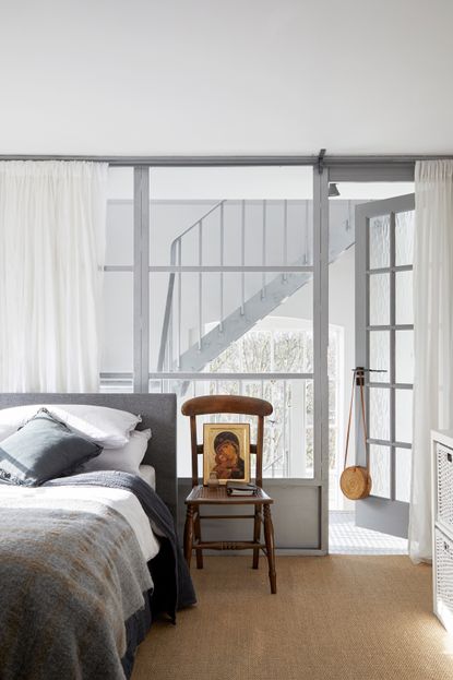 Grey bedroom with glass walls