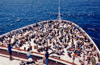 Solar eclipse chasers pack the deck of the MS Veendam cruise ship in the Caribbean Sea during the Feb. 26, 1998 total solar eclipse.
