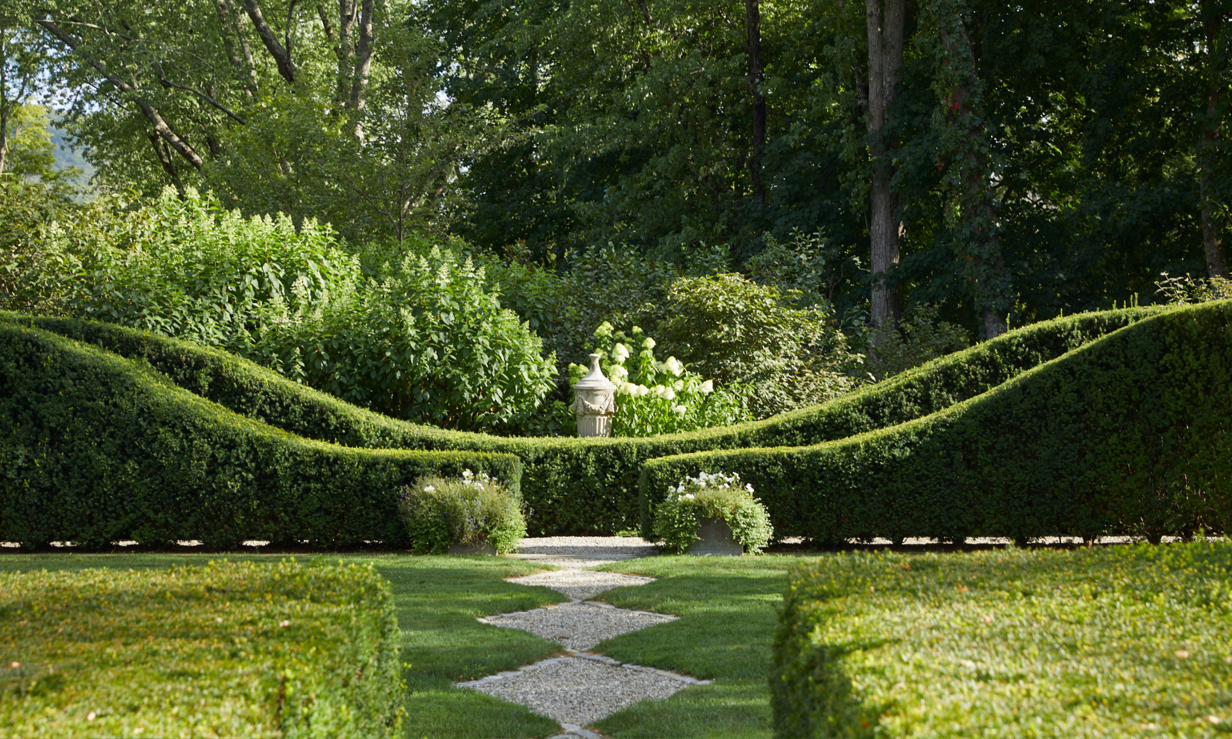 Clipped box hedging and lawn in traditional design