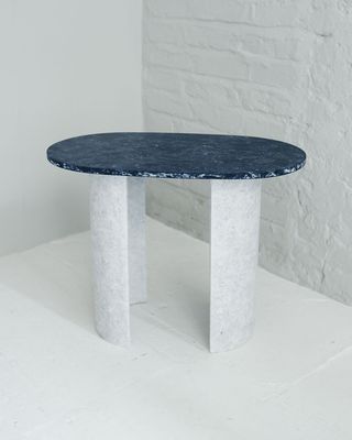 Marble table with a blue colored top and white legs