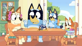 Cartoon blue heeler dogs Bingo and Bluey with their parents Bandit and Chilli gathered around the dining table