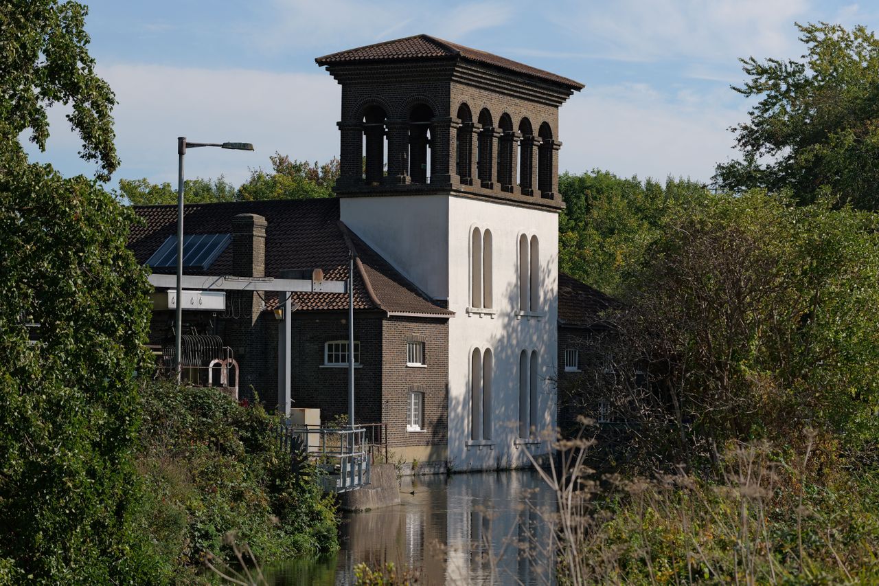 A pumphouse on the edge of a canal