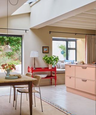 Modern kitchen with a vintage sideboard painted red