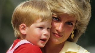 Diana, Princess of Wales holding Prince Harry in her arms while on holiday in Majorca, Spain on August 10, 1987.