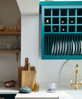 color contrast kitchen with color pop blue wall storage