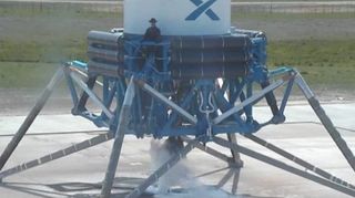 A mannequin rides SpaceX's Grasshopper reusable rocket during a March 7, 2013 test flight.