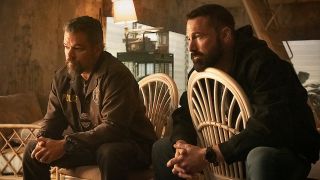 A promotional still from RIP featuring Matt Damon and Ben Affleck sitting attentively in chairs.