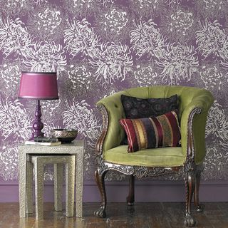 Living room with purple wallpaper and green chair