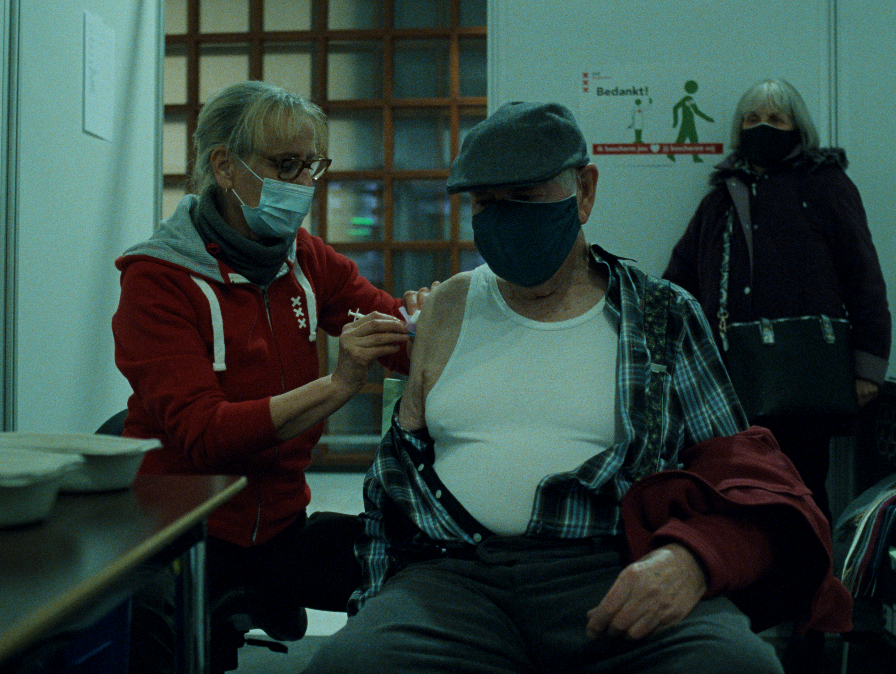 film still of man receiving injection