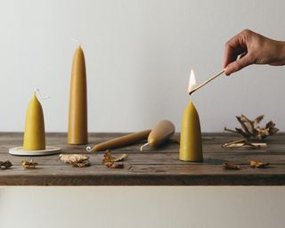 A group of chunky yellow beeswax candles