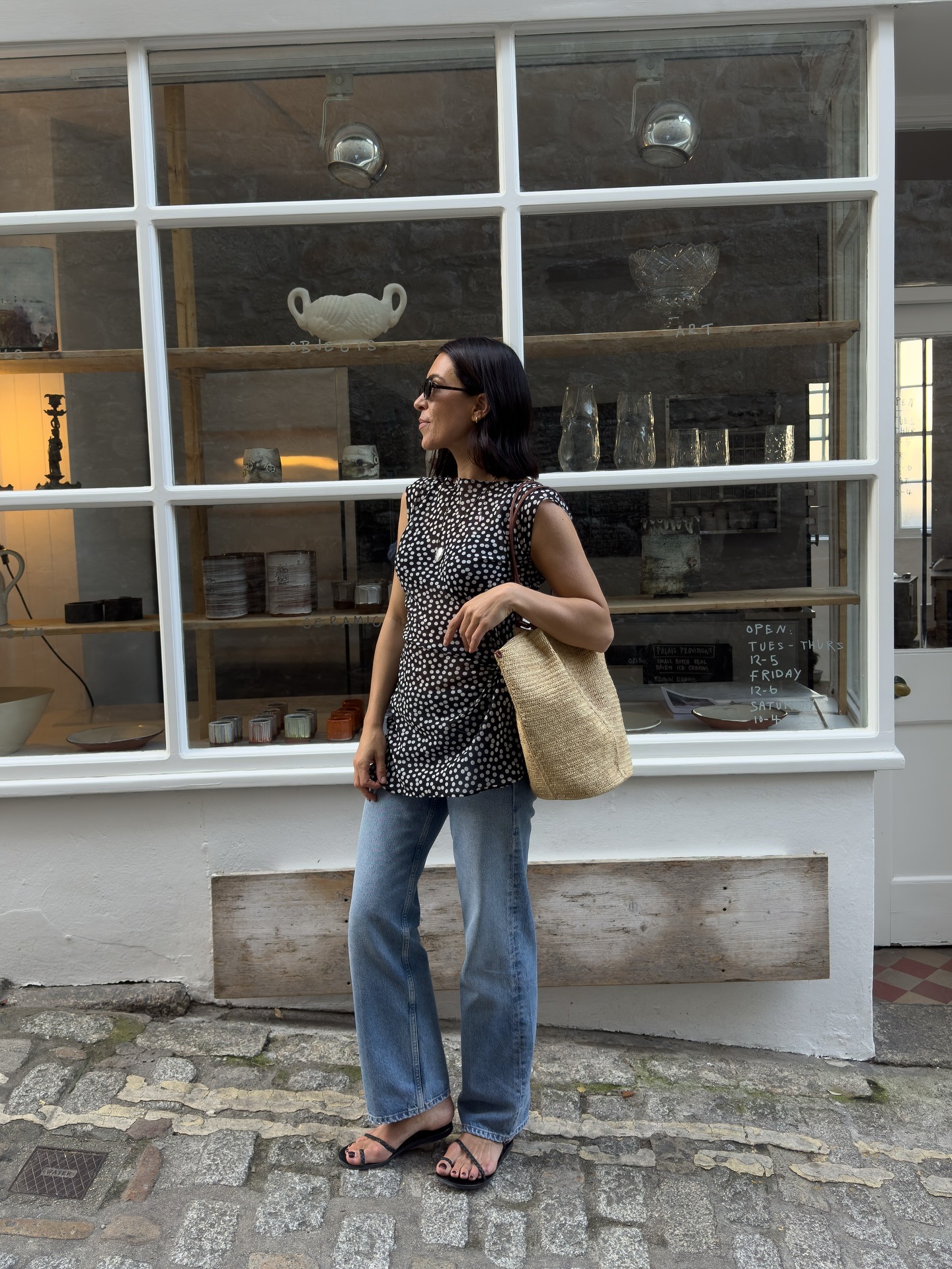 Woman in polka-dot top and jeans