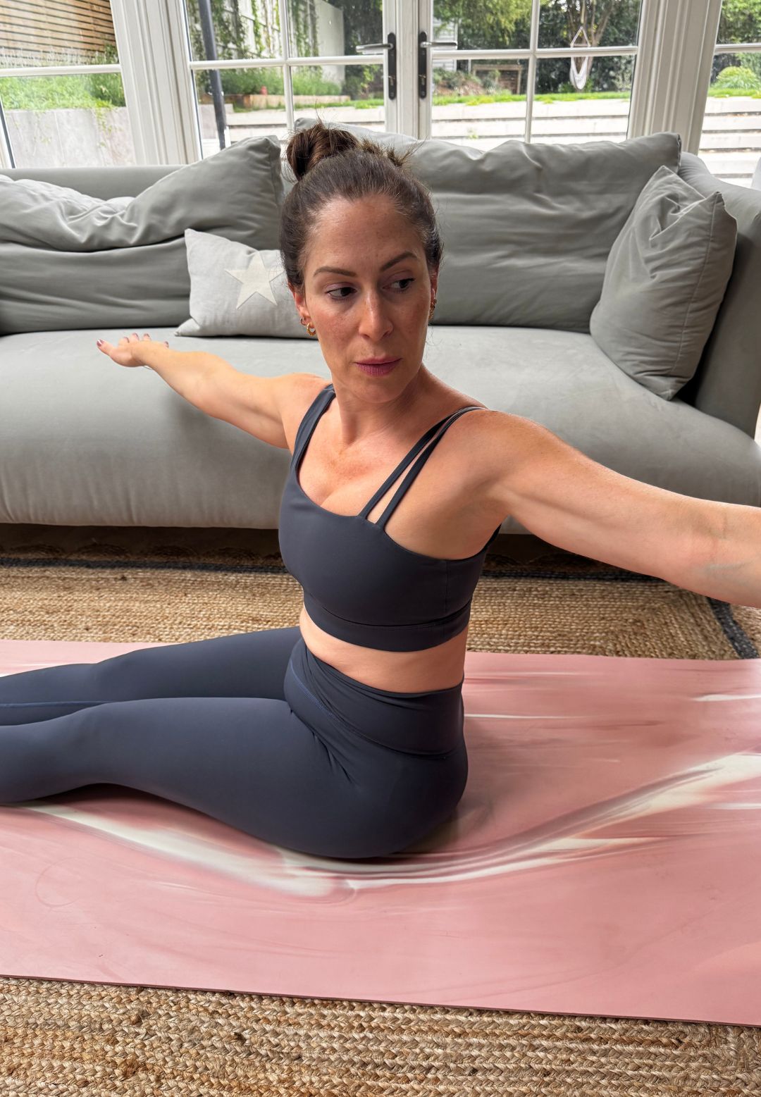 Anna during her Pilates spine twist challenge