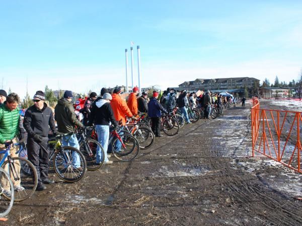 Team support crews stand at the ready waiting for their riders to come through.