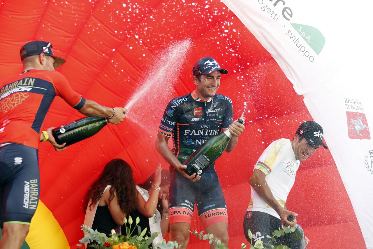The riders spray the champagne