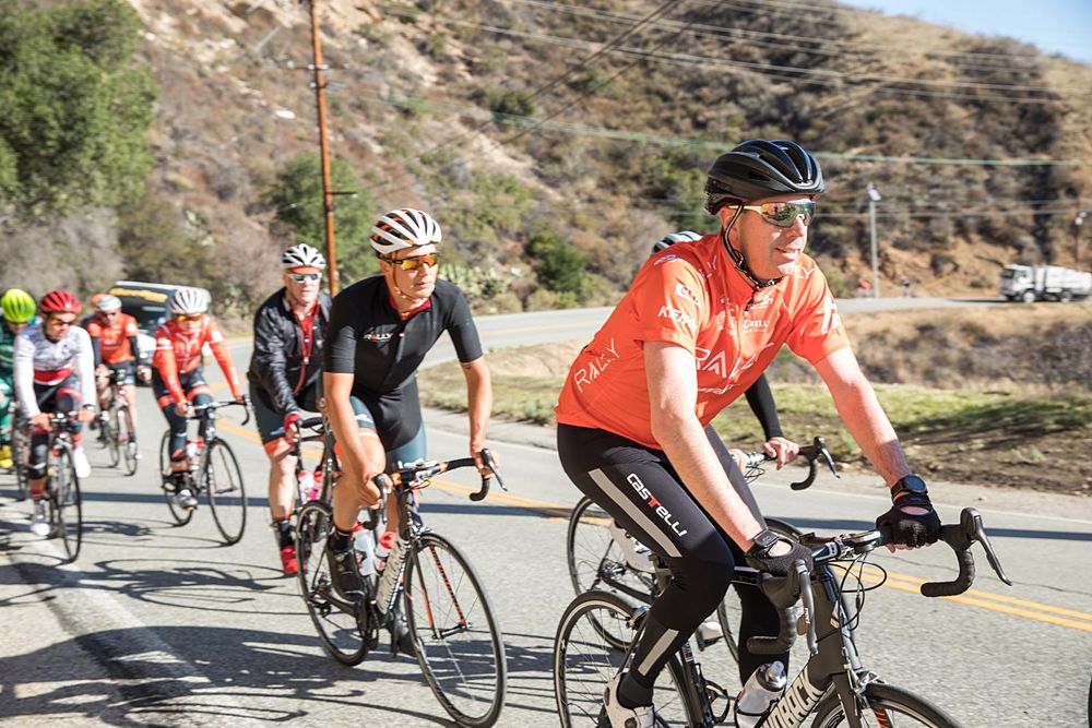 Rally Health's CCO Rhett Woods leads Adam De Vos at Rally Cycling team camp