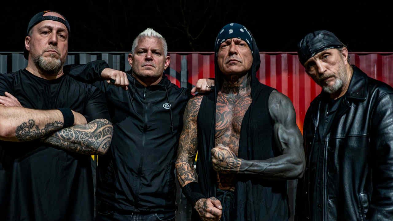 Biohazard posing for a photograph in 2025