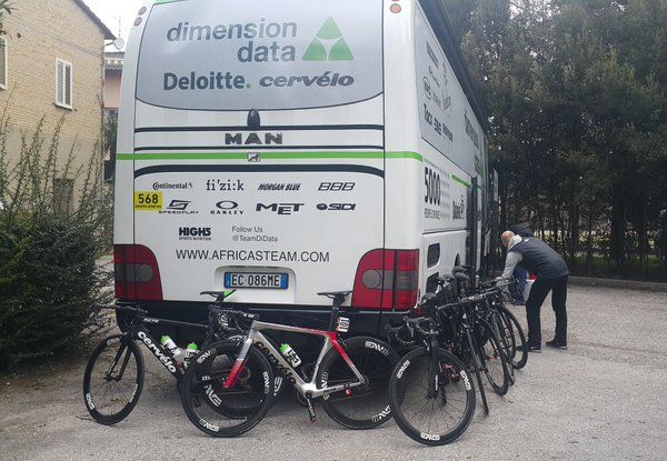 The Dimension Data mechanics get the riders' bike ready