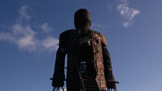 The Wicker Man looming against a blue sky. 