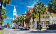 R36JXW St. Michaels Church and Broad St. in Charleston, SC