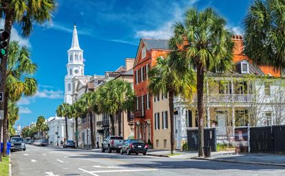 R36JXW St. Michaels Church and Broad St. in Charleston, SC