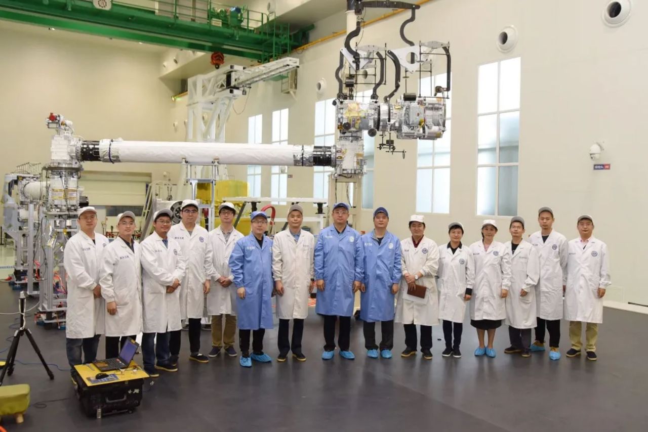 The China Academy of Space Technology team with the Tianhe robotic arm.