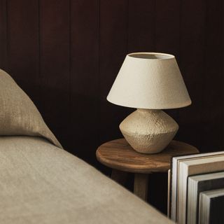 Small earthenware base lamp on side table